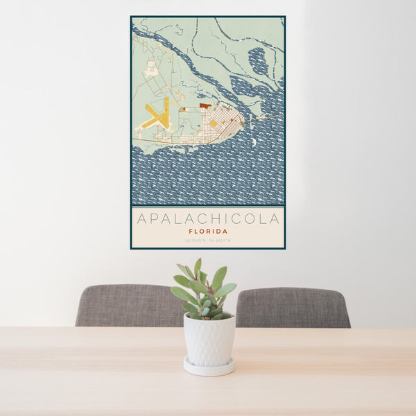 24x36 Apalachicola Florida Map Print Portrait Orientation in Woodblock Style Behind 2 Chairs Table and Potted Plant
