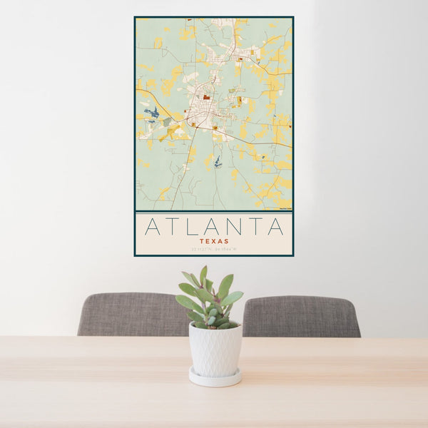 24x36 Atlanta Texas Map Print Portrait Orientation in Woodblock Style Behind 2 Chairs Table and Potted Plant