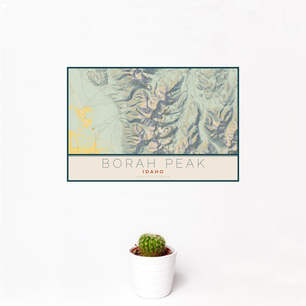 12x18 Borah Peak Idaho Map Print Landscape Orientation in Woodblock Style With Small Cactus Plant in White Planter