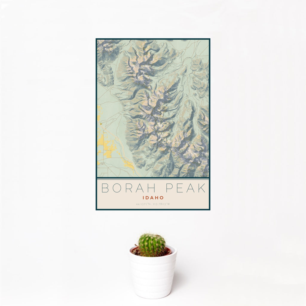12x18 Borah Peak Idaho Map Print Portrait Orientation in Woodblock Style With Small Cactus Plant in White Planter