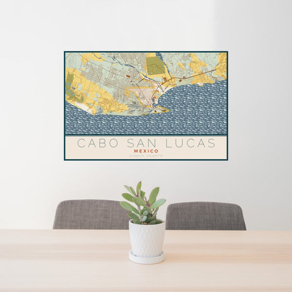 24x36 Cabo San Lucas Mexico Map Print Lanscape Orientation in Woodblock Style Behind 2 Chairs Table and Potted Plant