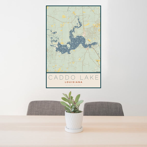 24x36 Caddo lake Louisiana Map Print Portrait Orientation in Woodblock Style Behind 2 Chairs Table and Potted Plant