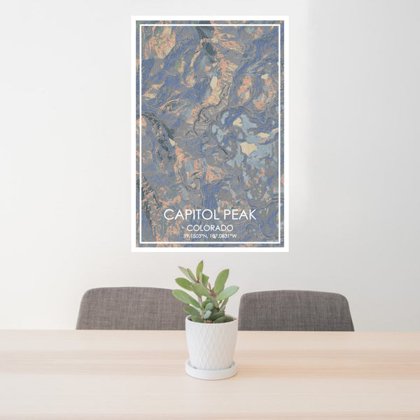 24x36 Capitol Peak Colorado Map Print Portrait Orientation in Afternoon Style Behind 2 Chairs Table and Potted Plant