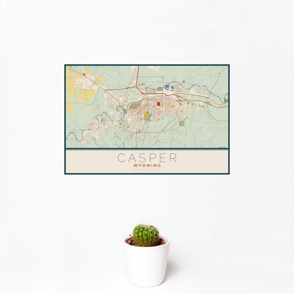 12x18 Casper Wyoming Map Print Landscape Orientation in Woodblock Style With Small Cactus Plant in White Planter