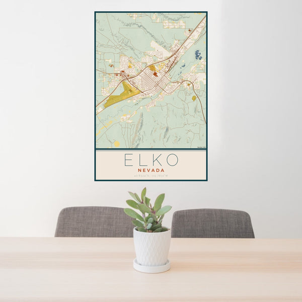 24x36 Elko Nevada Map Print Portrait Orientation in Woodblock Style Behind 2 Chairs Table and Potted Plant