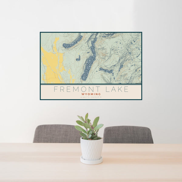 24x36 Fremont Lake Wyoming Map Print Lanscape Orientation in Woodblock Style Behind 2 Chairs Table and Potted Plant