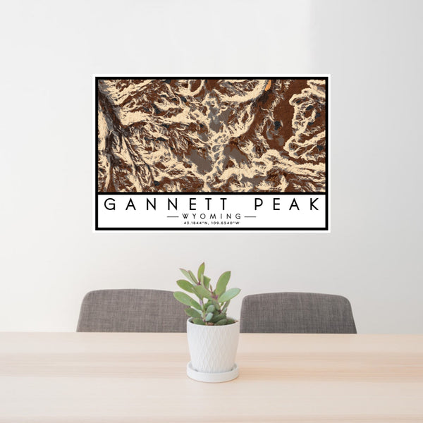 24x36 Gannett Peak Wyoming Map Print Lanscape Orientation in Ember Style Behind 2 Chairs Table and Potted Plant