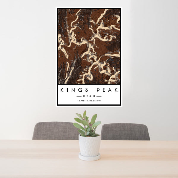 24x36 Kings Peak Utah Map Print Portrait Orientation in Ember Style Behind 2 Chairs Table and Potted Plant