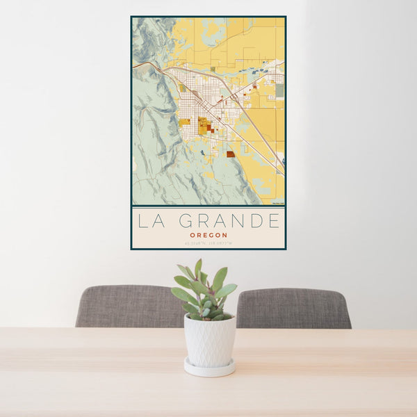 24x36 La Grande Oregon Map Print Portrait Orientation in Woodblock Style Behind 2 Chairs Table and Potted Plant