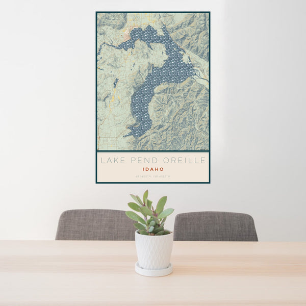 24x36 Lake Pend Oreille Idaho Map Print Portrait Orientation in Woodblock Style Behind 2 Chairs Table and Potted Plant