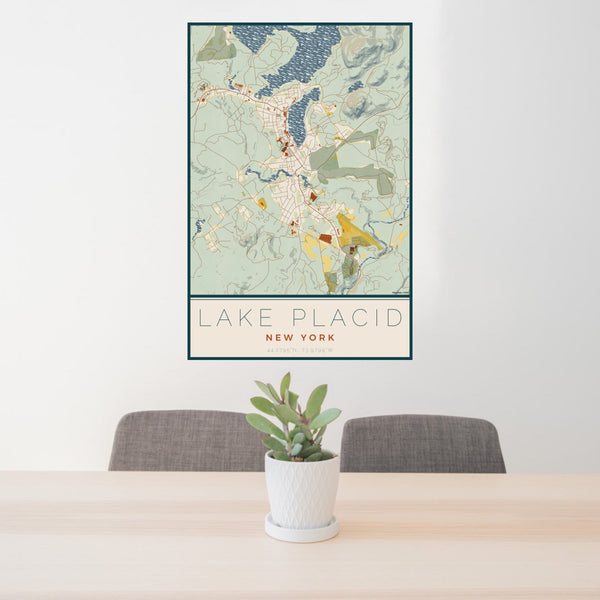 24x36 Lake Placid New York Map Print Portrait Orientation in Woodblock Style Behind 2 Chairs Table and Potted Plant