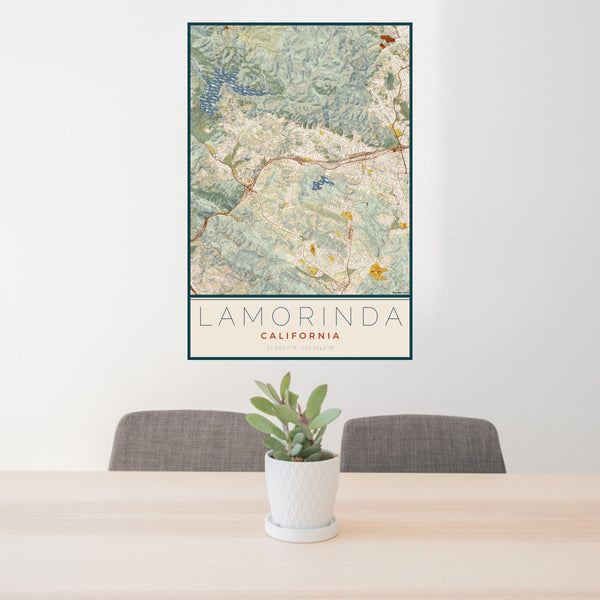 24x36 Lamorinda California Map Print Portrait Orientation in Woodblock Style Behind 2 Chairs Table and Potted Plant