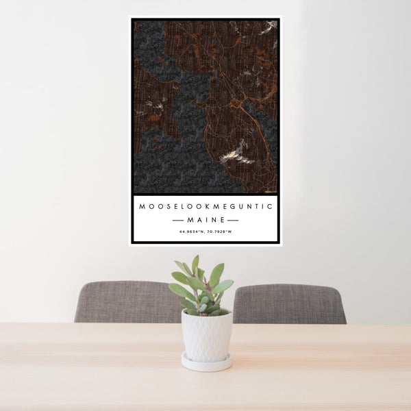 24x36 Mooselookmeguntic Maine Map Print Portrait Orientation in Ember Style Behind 2 Chairs Table and Potted Plant