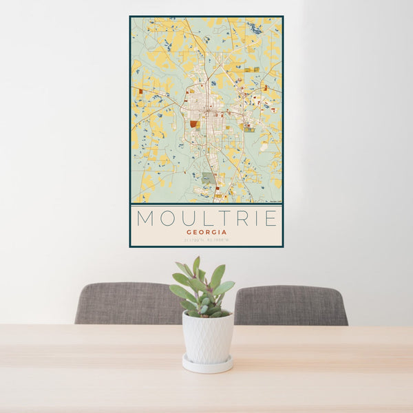 24x36 Moultrie Georgia Map Print Portrait Orientation in Woodblock Style Behind 2 Chairs Table and Potted Plant