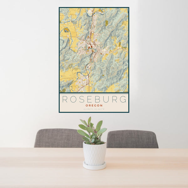 24x36 Roseburg Oregon Map Print Portrait Orientation in Woodblock Style Behind 2 Chairs Table and Potted Plant