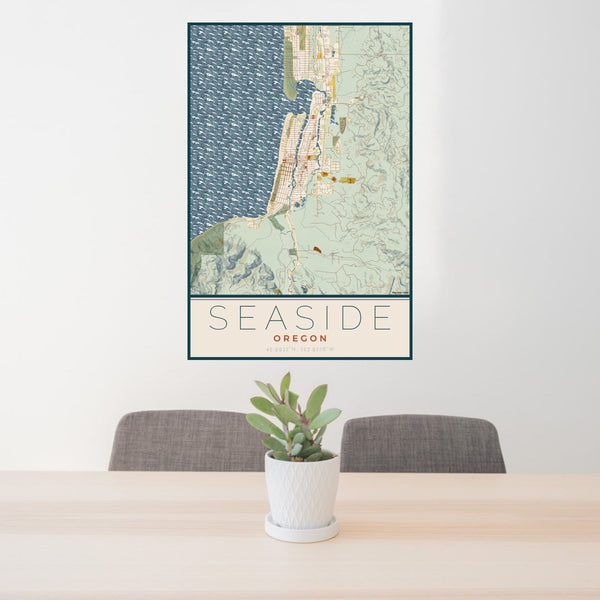 24x36 Seaside Oregon Map Print Portrait Orientation in Woodblock Style Behind 2 Chairs Table and Potted Plant