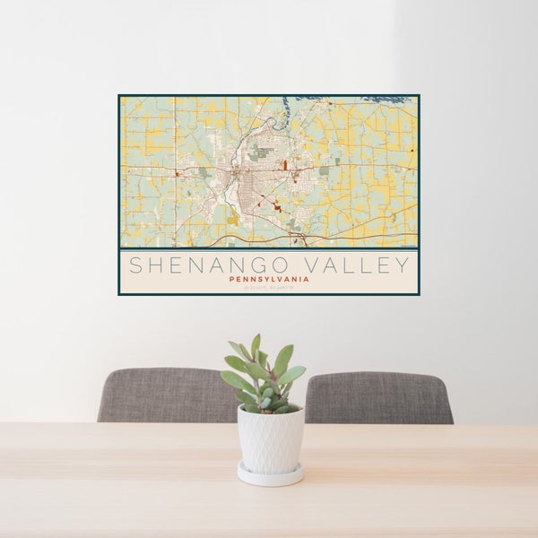 24x36 Shenango Valley Pennsylvania Map Print Lanscape Orientation in Woodblock Style Behind 2 Chairs Table and Potted Plant