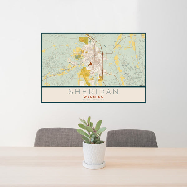 24x36 Sheridan Wyoming Map Print Lanscape Orientation in Woodblock Style Behind 2 Chairs Table and Potted Plant