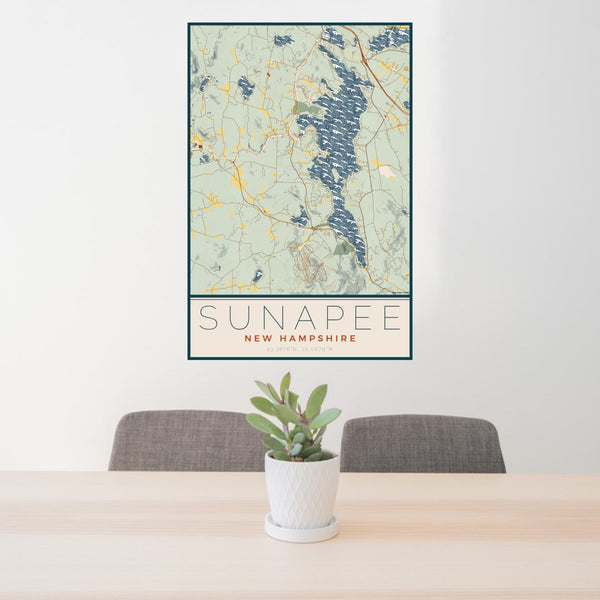 24x36 Sunapee New Hampshire Map Print Portrait Orientation in Woodblock Style Behind 2 Chairs Table and Potted Plant
