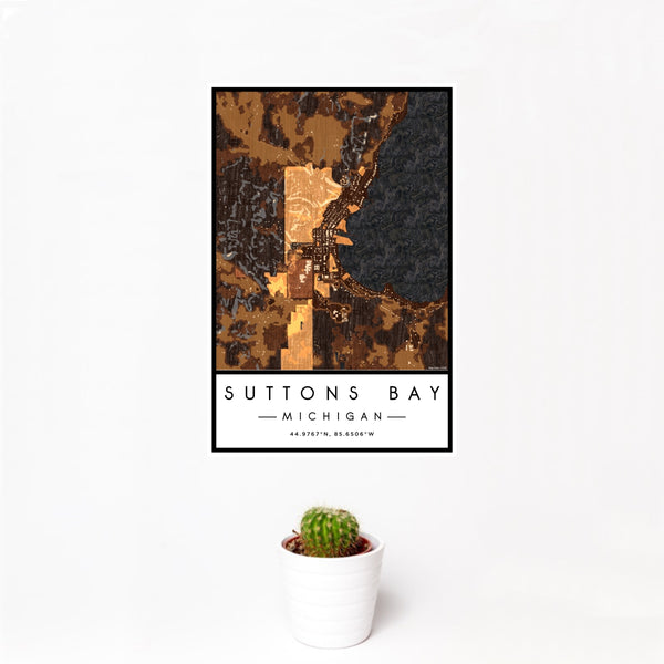 12x18 Suttons Bay Michigan Map Print Portrait Orientation in Ember Style With Small Cactus Plant in White Planter