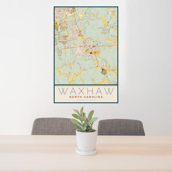 24x36 Waxhaw North Carolina Map Print Portrait Orientation in Woodblock Style Behind 2 Chairs Table and Potted Plant