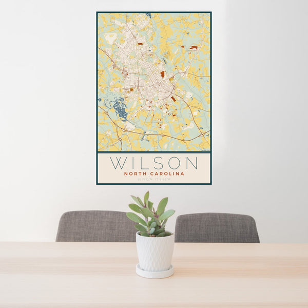 24x36 Wilson North Carolina Map Print Portrait Orientation in Woodblock Style Behind 2 Chairs Table and Potted Plant