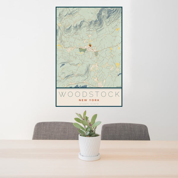 24x36 Woodstock New York Map Print Portrait Orientation in Woodblock Style Behind 2 Chairs Table and Potted Plant