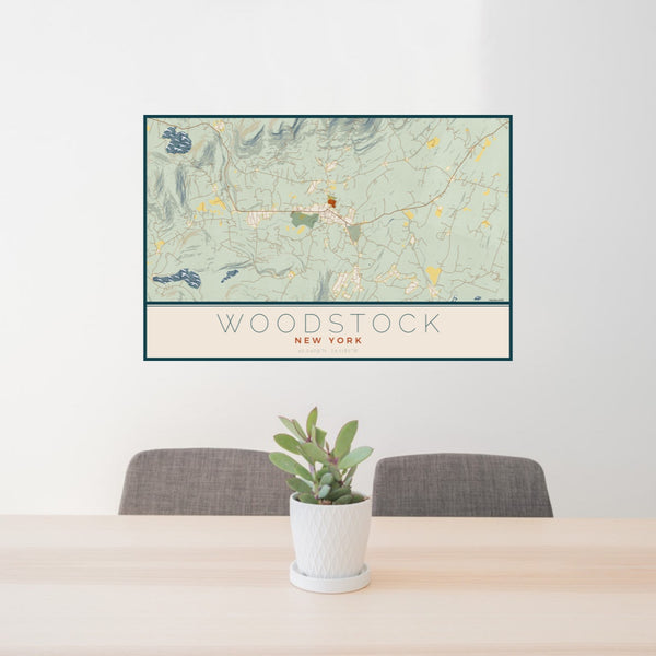 24x36 Woodstock New York Map Print Landscape Orientation in Woodblock Style Behind 2 Chairs Table and Potted Plant