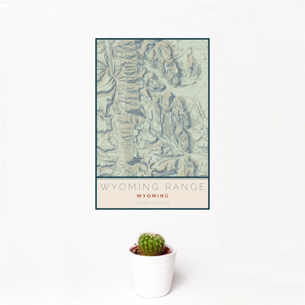 12x18 Wyoming Range Wyoming Map Print Portrait Orientation in Woodblock Style With Small Cactus Plant in White Planter